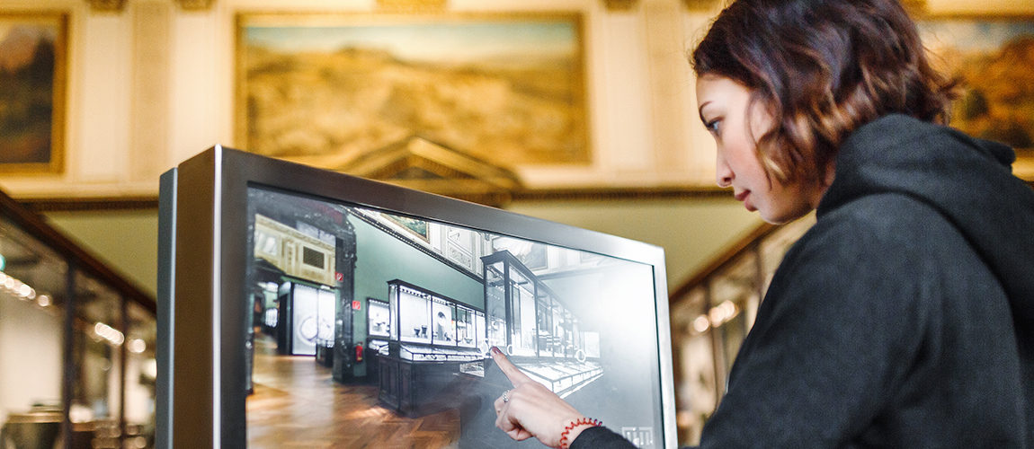 A Woman In The Museum Uses The Touchscreen Monitor Electronic Guide, The Concept Of Modern Education