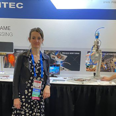 Gwenn, our product line manager standing in front of Precitec's booth