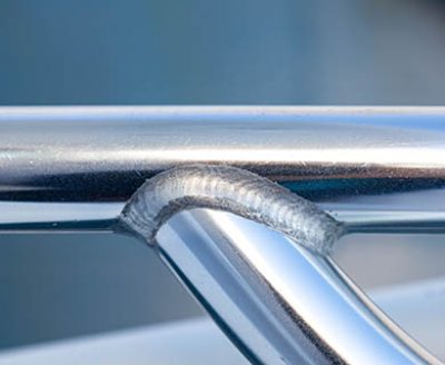 Welding joint of aluminum tubes close-up.